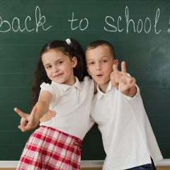 cheerful-boy-girl-blackboard