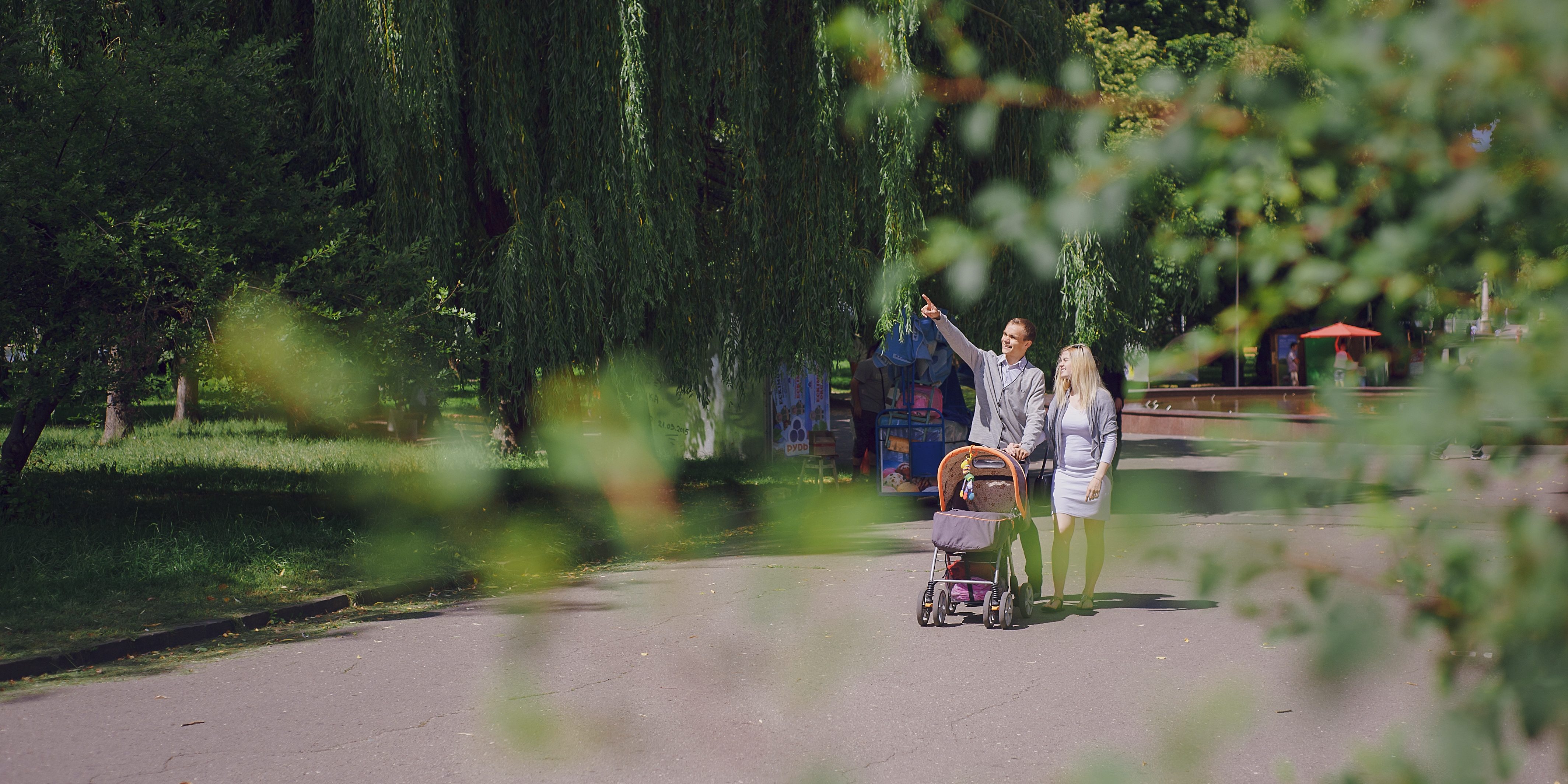 young-father-pointing-something-his-partner